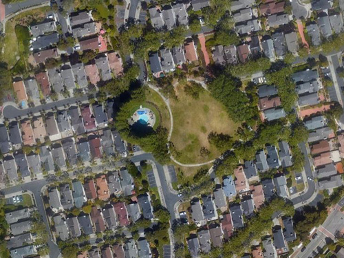 Overhead drone shot of homes in the Normandy Homeowners Association located in Alameda, California.